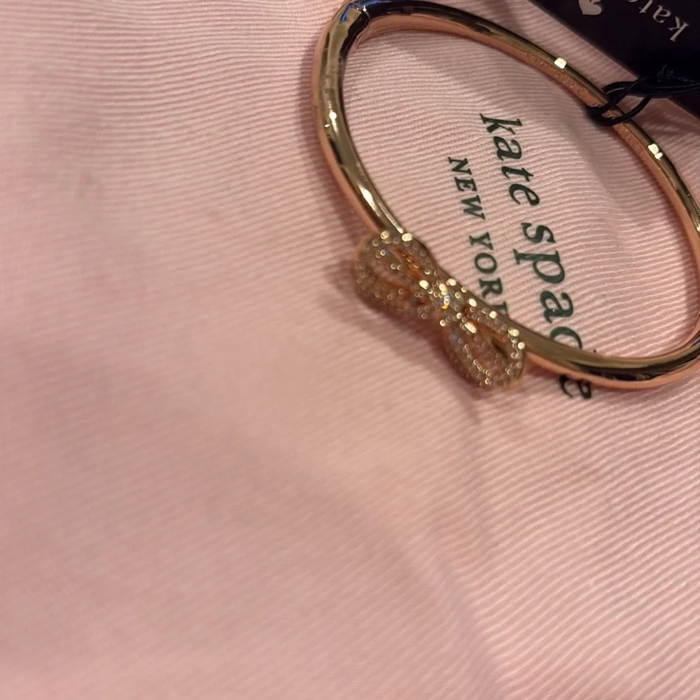 Rose gold Kate Spade bracelet with bow on top. Never used. Tag included. - Picture 2 of 4